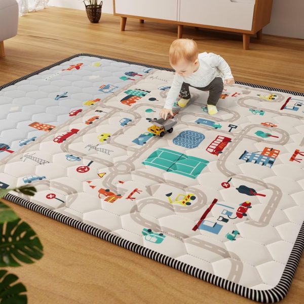 Baby playing on city map play mat