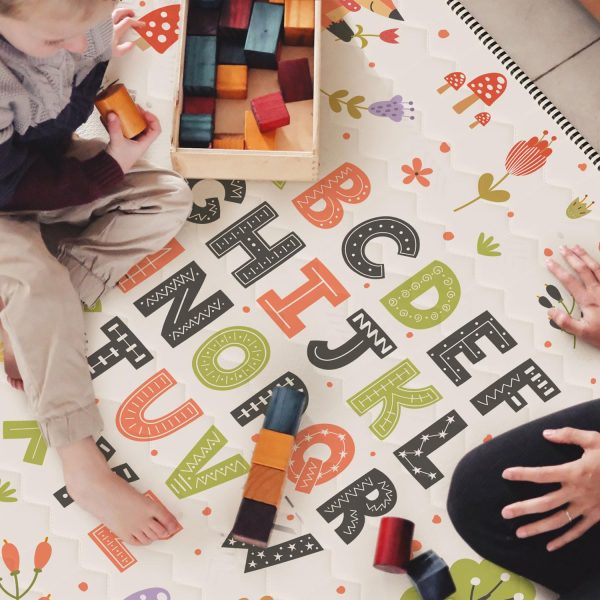 toddler walking on thick quilted playmat